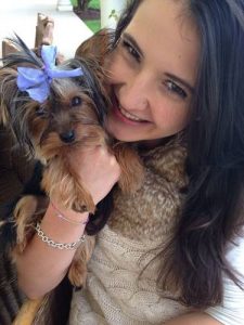 Toy Yorkie with her owner Marina